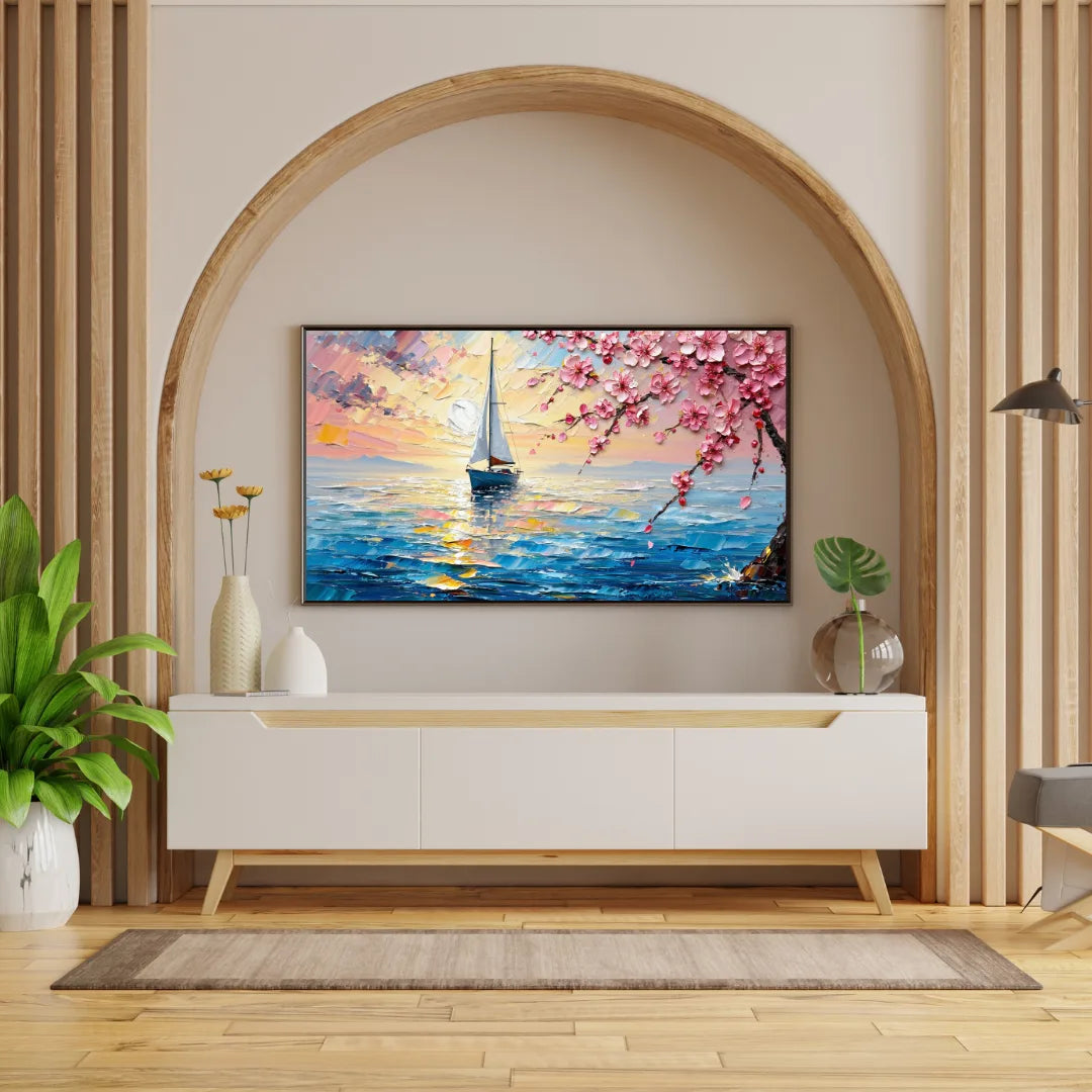 Modern living room with a decorative painting of a sunset and cherry blossoms on a wall.