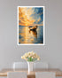 A framed vertical art print depicting a serene sunset over a calm lake with a small boat, displayed on a light gray wall above a dining table with white chairs and a vase of tulips.
