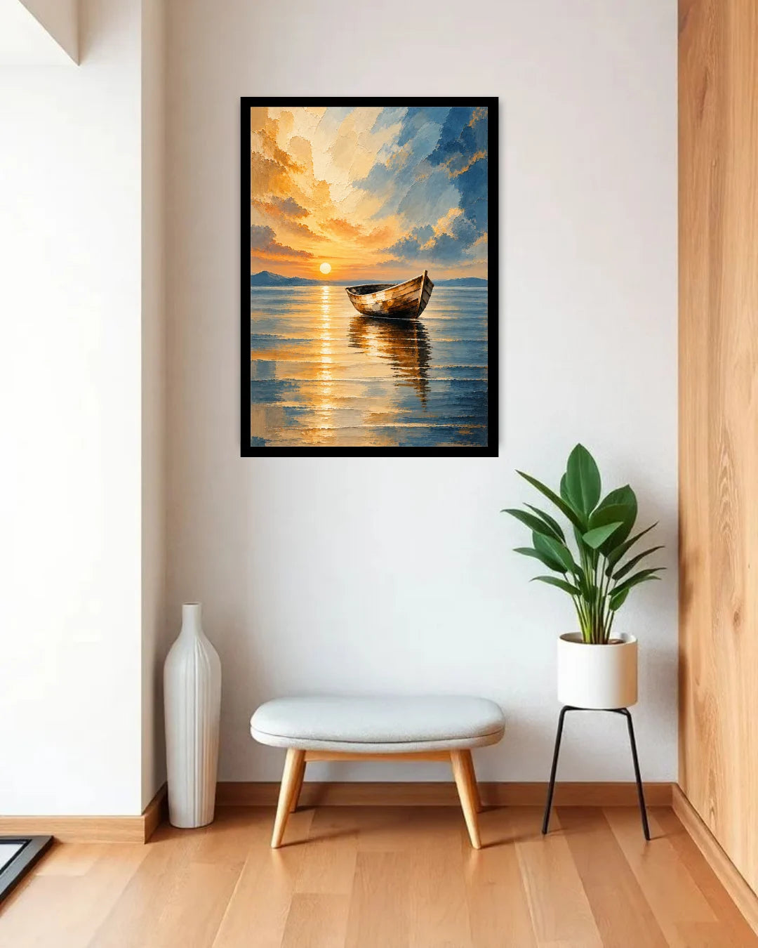 A framed vertical canvas print of a sunset boat scene on water, displayed on a white wall in a modern room setting with a bench, potted plant, and vase.