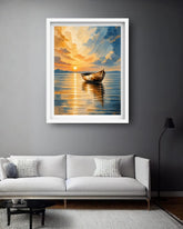 A framed art print depicting a serene sunset over a lake with a small boat, displayed on a dark gray wall above a modern white sofa in a living room setting.