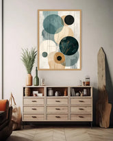 Room interior with a wooden dresser, abstract wall art, and decorative items.