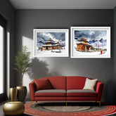 A modern living room setting featuring two framed watercolor paintings of traditional mountain temples in snowy landscapes, hung on a dark gray wall above a red sofa.