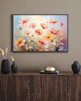 Soft pastel floral wall art canvas displayed above a dark wooden cabinet
