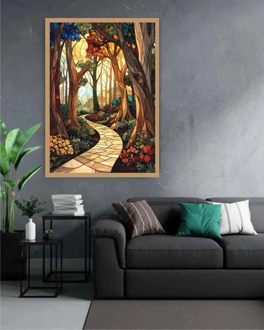 A framed vertical art print depicting a winding stone path through a dense, colorful forest, displayed on a gray wall above a dark gray sofa in a modern living room setting.