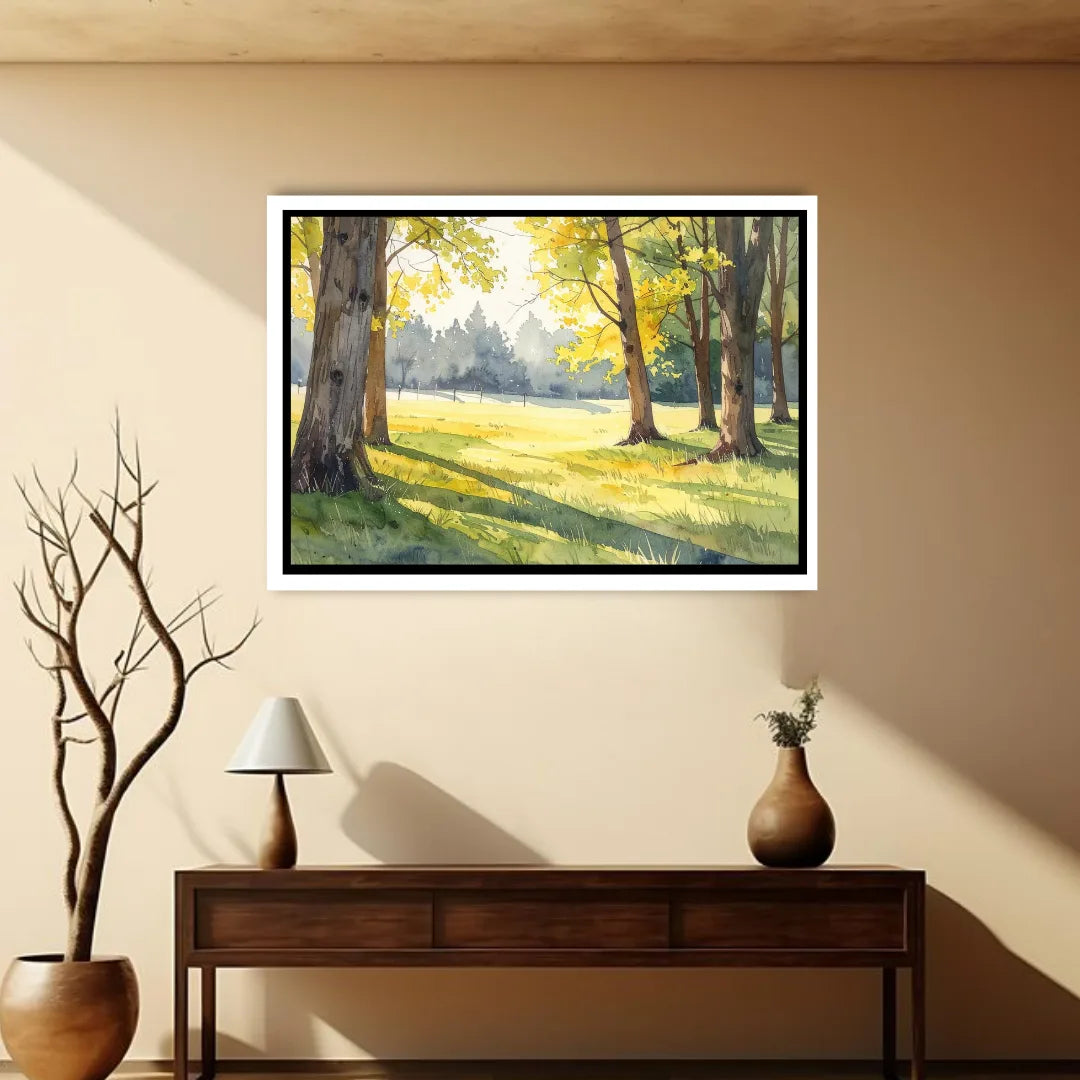 Framed landscape painting of a sunlit forest on a beige wall above a wooden console table.
