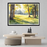 Framed landscape painting of a sunlit forest on a wall above a modern table and chairs.
