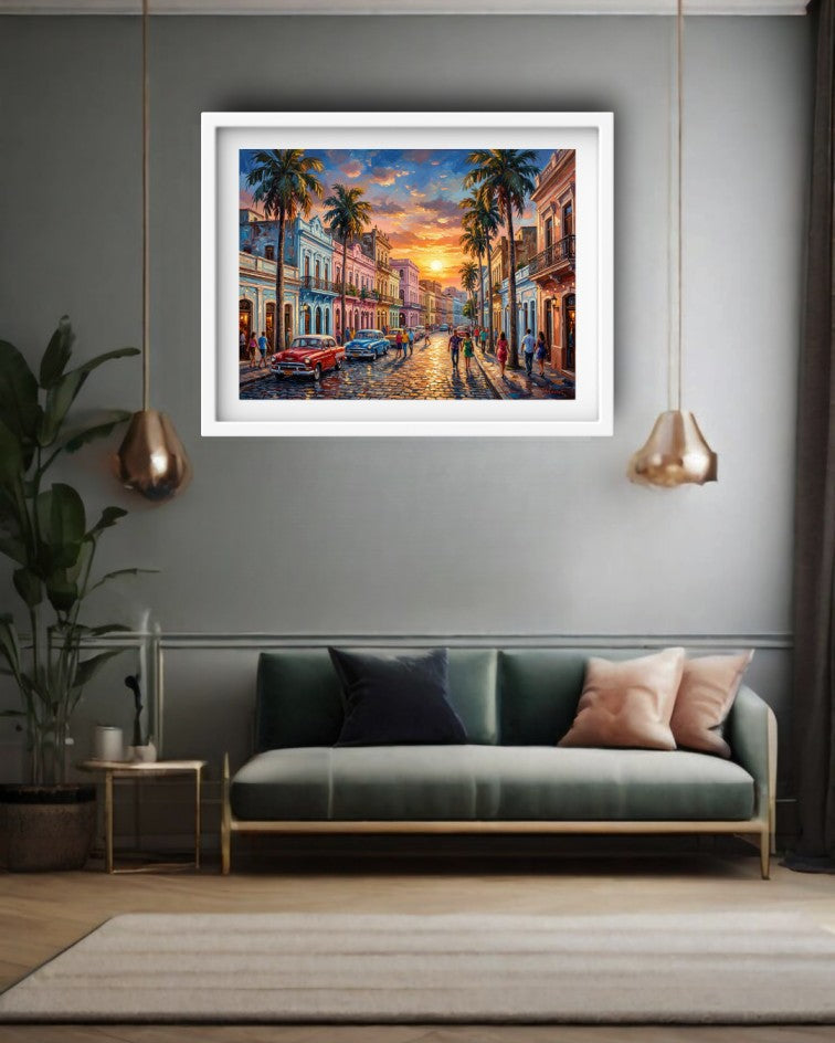 A framed colorful painting of a tropical street at sunset with palm trees and vintage cars, displayed on a gray wall above a green sofa in a modern living room setting.