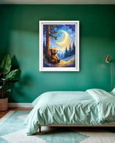 A framed art print depicting a cozy bear sitting under a crescent moon in a forest, displayed on a dark green wall above a bed in a styled bedroom.