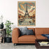 A vintage-style Paris travel poster featuring the Eiffel Tower, boats on the Seine, and the word PARIS at the bottom, displayed above a brown leather sofa in a living room setting.