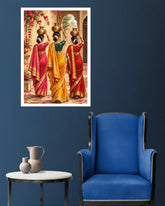 A framed wall art print depicting three women in colorful traditional saris carrying brass pots, displayed on a dark blue wall above a blue armchair and a small side table with vases.