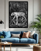 Living room with a blue sofa, decorative pillows, and a framed black and white tiger artwork on the wall.
