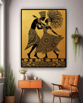 Tribal dancing couple wall art canvas displayed in a minimalist interior with chair and plants
