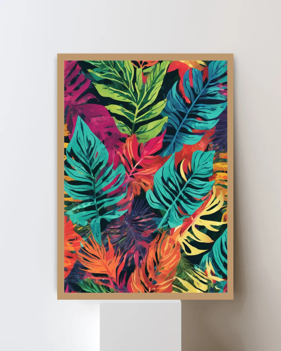 Framed colorful tropical leaf print on a white wall