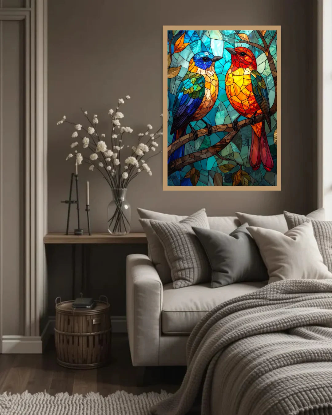 Living room with a couch, decorative pillows, and a colorful stained glass-style bird painting on the wall.