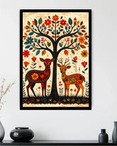 Decorative wall art with two deer and a tree on a beige background, framed in black.