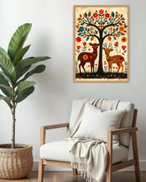 Decorative wall art with deer and floral design above a cozy chair with a blanket.