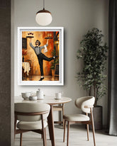 A framed art print depicting a waiter in a restaurant, displayed on a gray wall in a modern dining room setting with a table, chairs, and a potted plant.