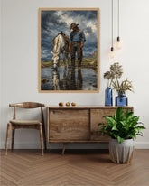 Western cowboy with horse framed canvas print displayed above a wooden console table in a stylish home.