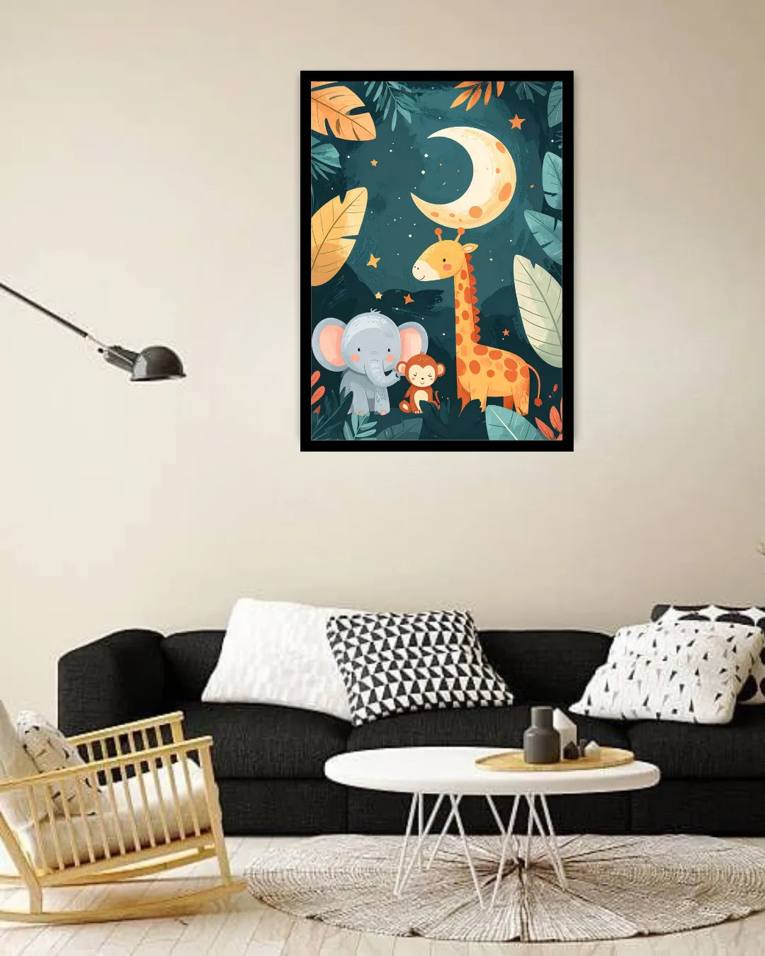 A framed vertical wall art print featuring a whimsical jungle night scene with a crescent moon, elephant, giraffe, and monkey, displayed above a black sofa in a modern living room setting.