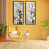 White lily floral wall art canvas set displayed on a yellow accent wall in a modern interior
