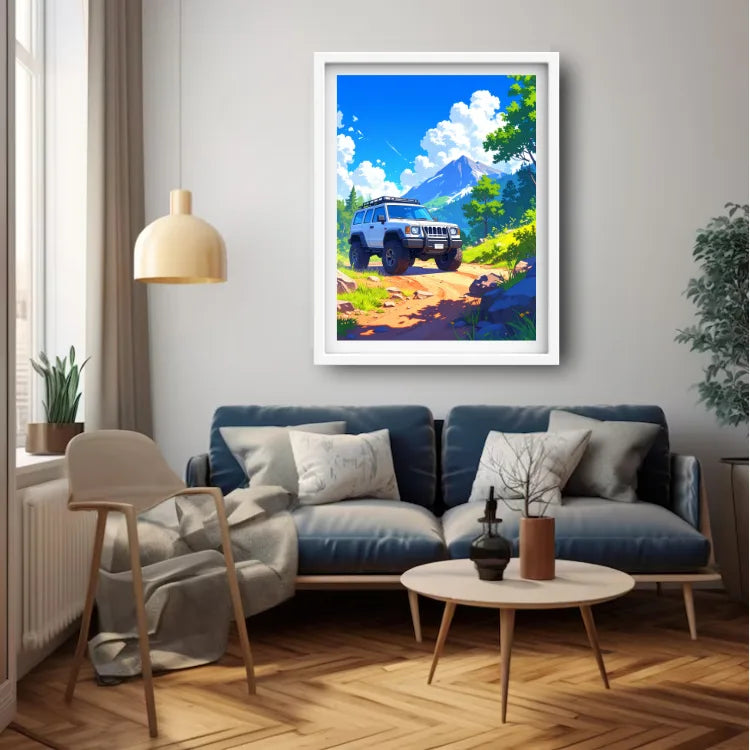 A framed art print depicting a blue SUV on a dirt road with a mountain in the background, displayed on a light gray wall above a blue sofa in a modern living room setting.