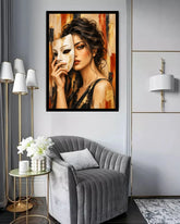 A framed wall art print depicting a woman holding a white mask, displayed in a modern living room setting above a gray velvet armchair.