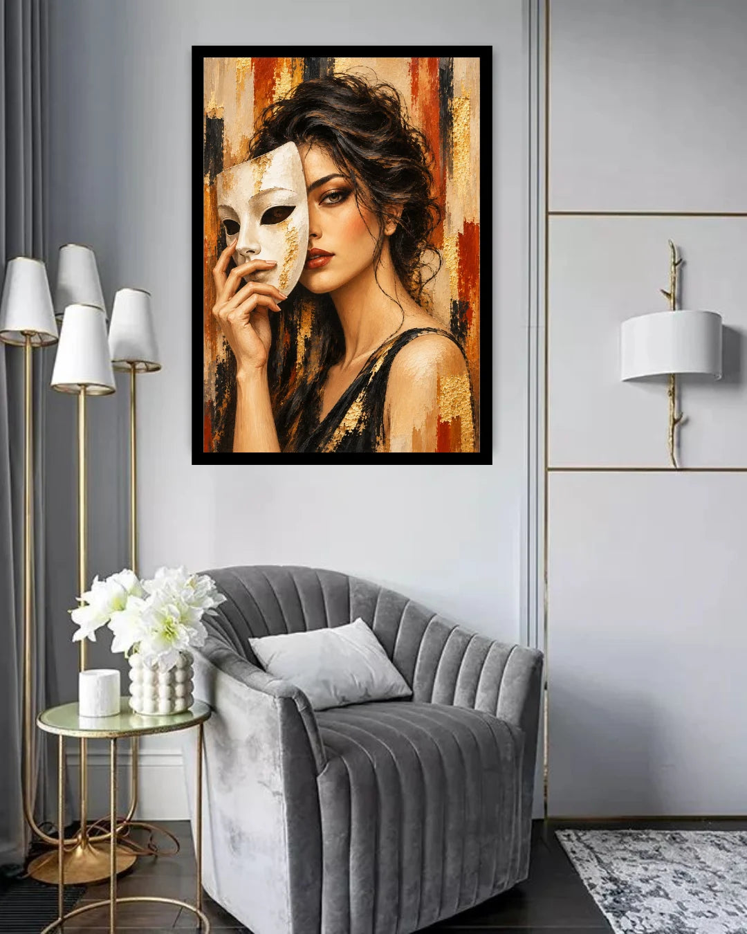 A framed wall art print depicting a woman holding a white mask, displayed in a modern living room setting above a gray velvet armchair.